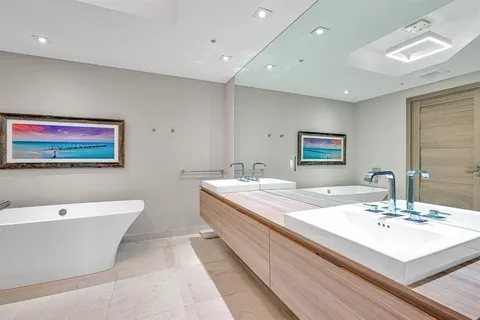 a view of a park with a slide and potted plants