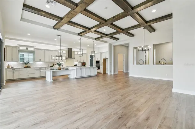 a kitchen with a sink and chandelier