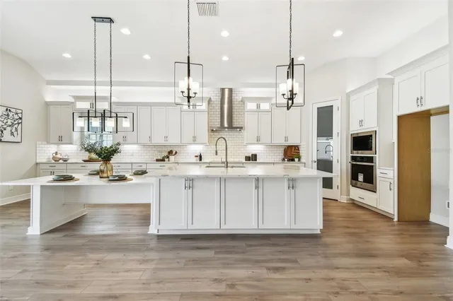 a bathroom with a sink vanity and mirror