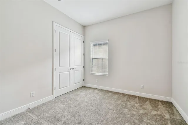 a view of a house with garden and porch