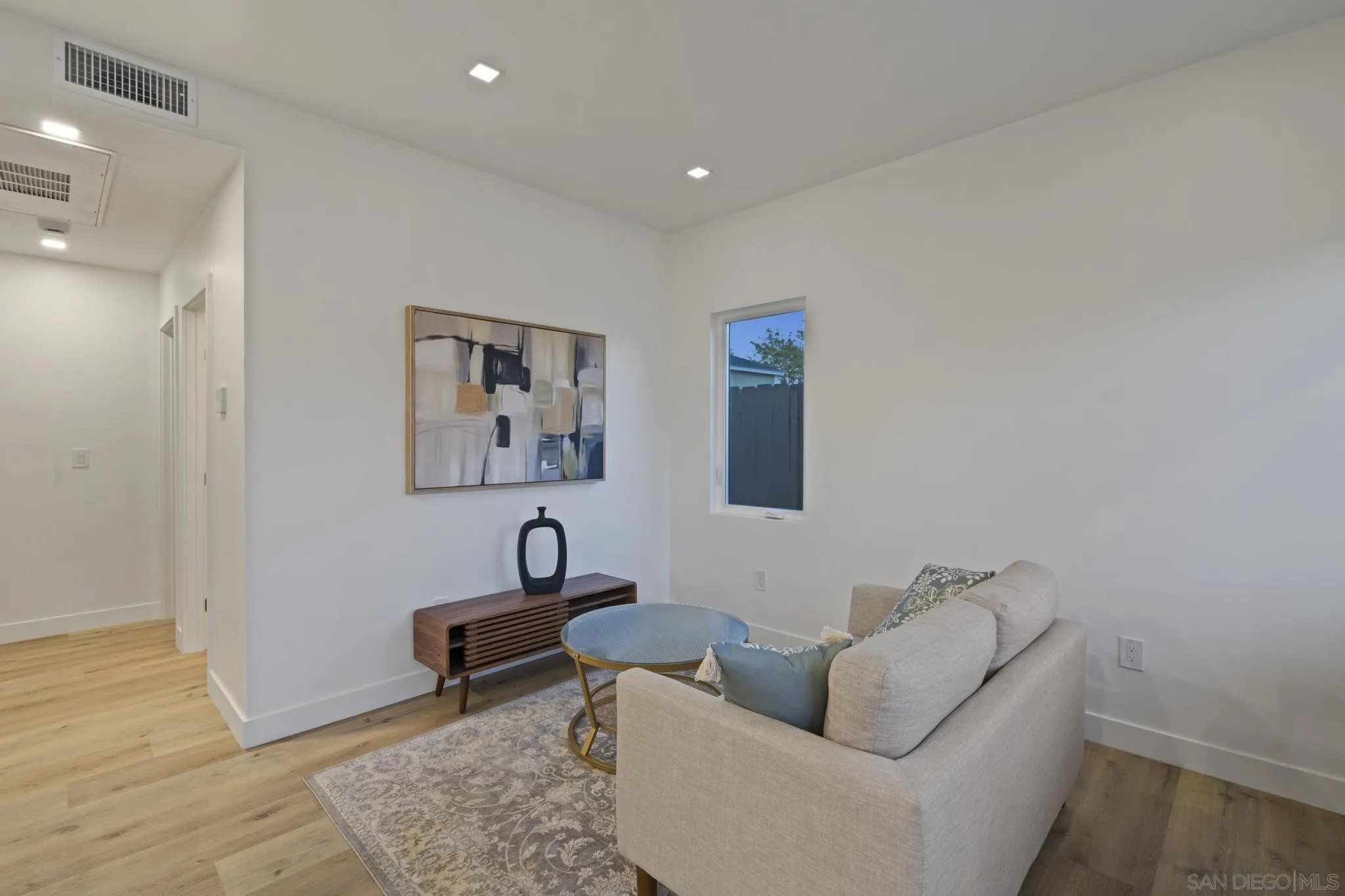 3582 Hatteras Avenue San Diego, CA 92117 - Photo 13 of 33 a living room with furniture and a rug