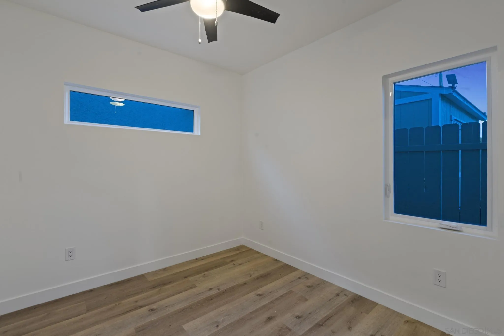 3582 Hatteras Avenue San Diego, CA 92117 - Photo 20 of 33 a view of a hallway with wooden floor and closet