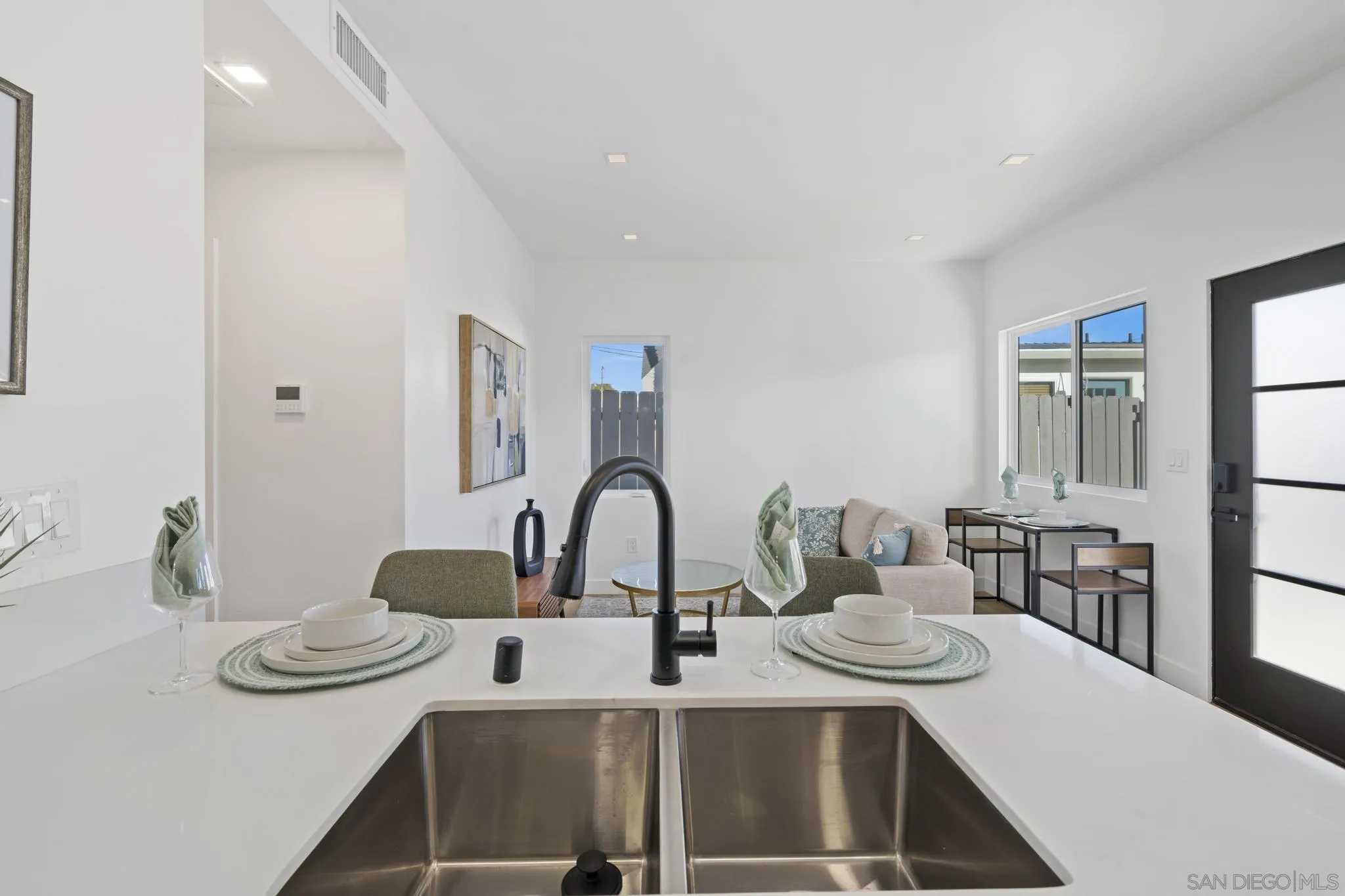 3582 Hatteras Avenue San Diego, CA 92117 - Photo 25 of 33 a kitchen with a table and chairs in it
