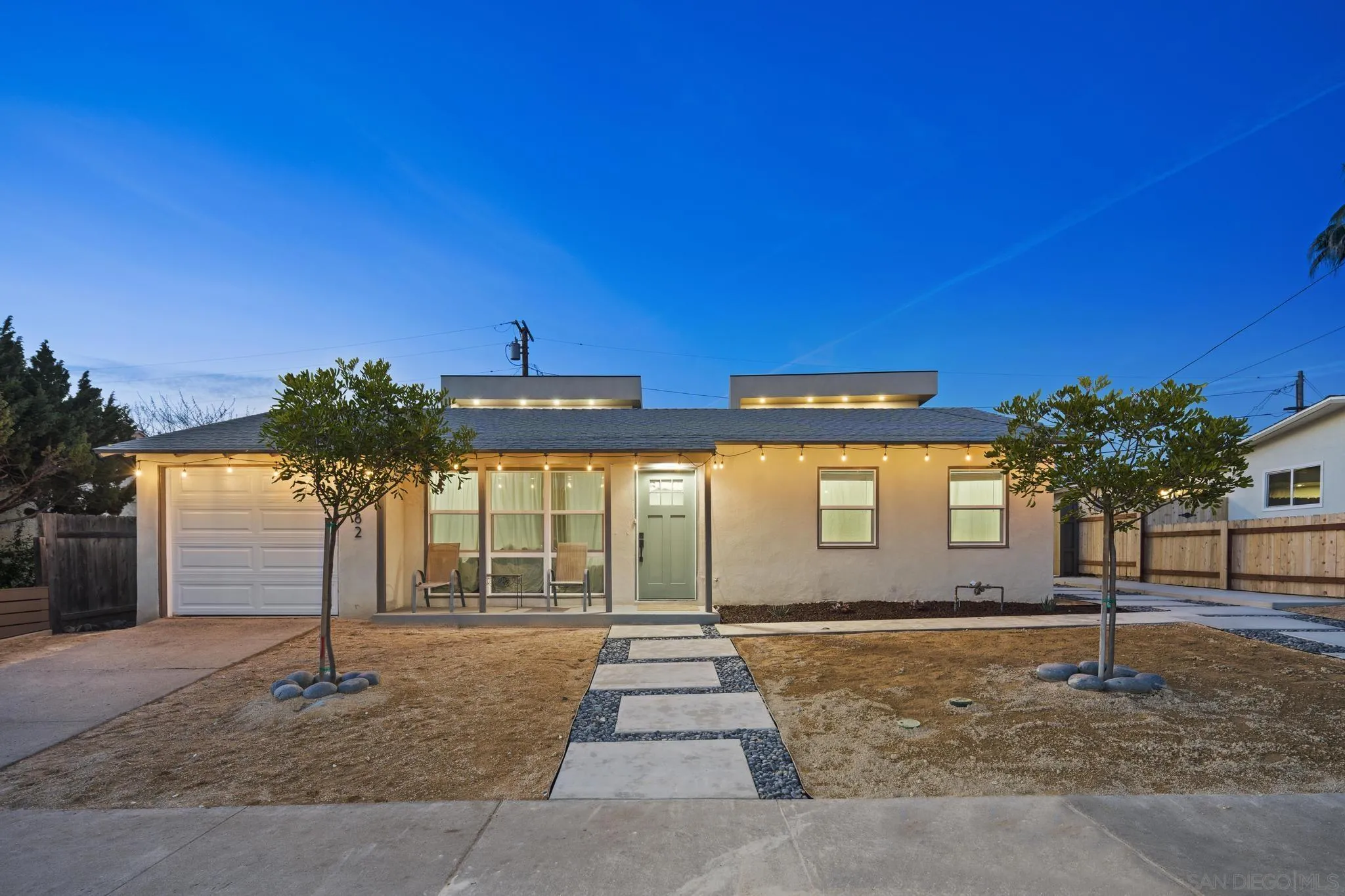 3582 Hatteras Avenue San Diego, CA 92117 - Photo 27 of 33 a front view of a house with a yard