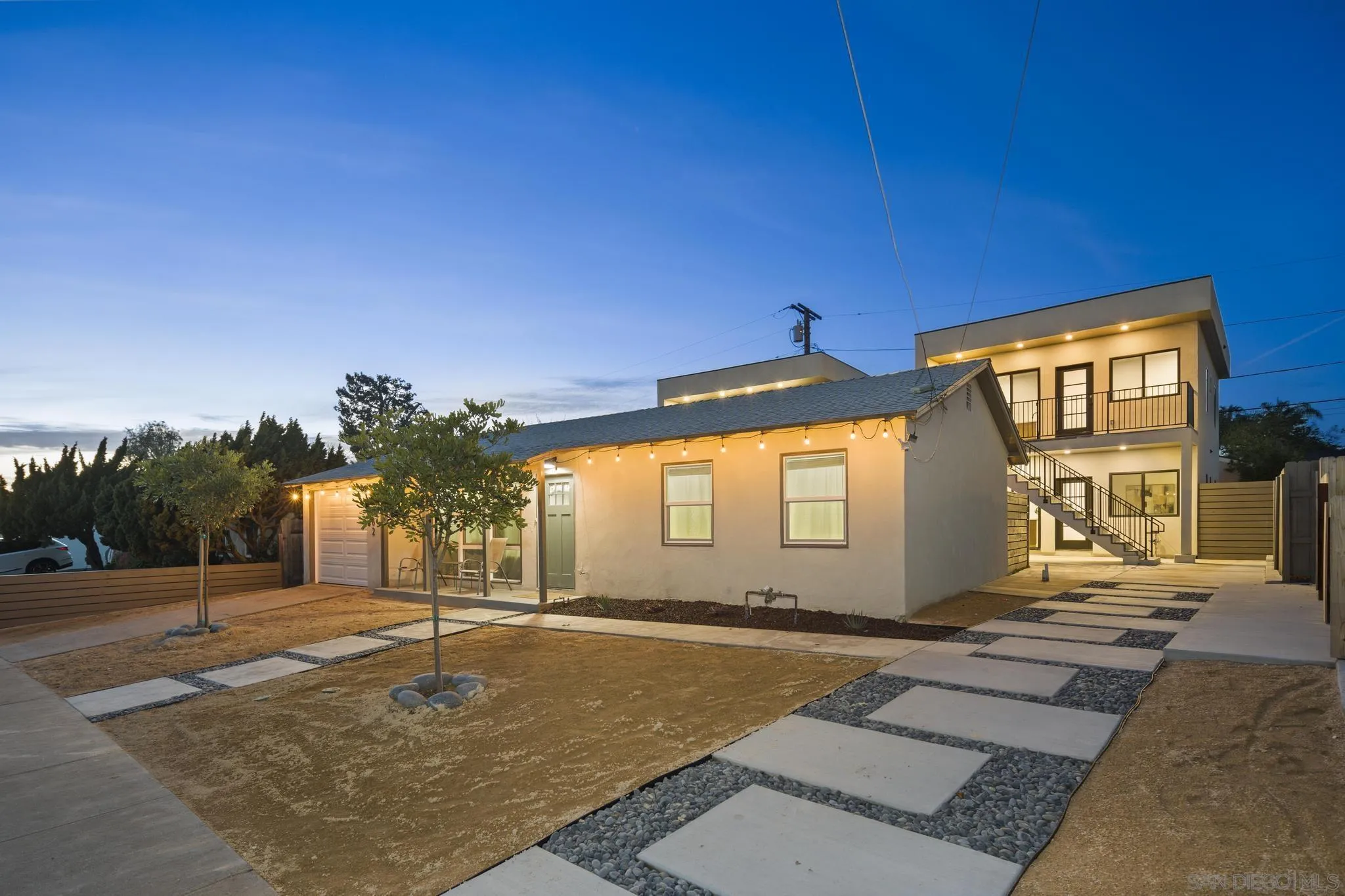3582 Hatteras Avenue San Diego, CA 92117 - Photo 3 of 33 a front view of a house with a yard