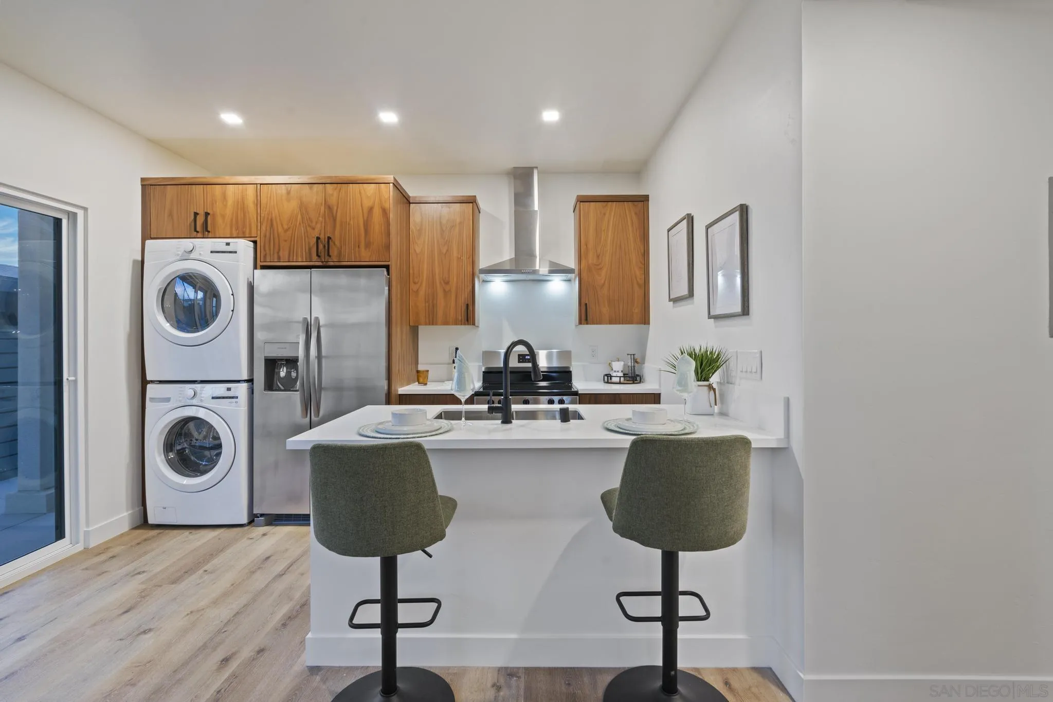 3582 Hatteras Avenue San Diego, CA 92117 - Photo 10 of 33 a view of kitchen with stainless steel appliances granite countertop sink stove and cabinets