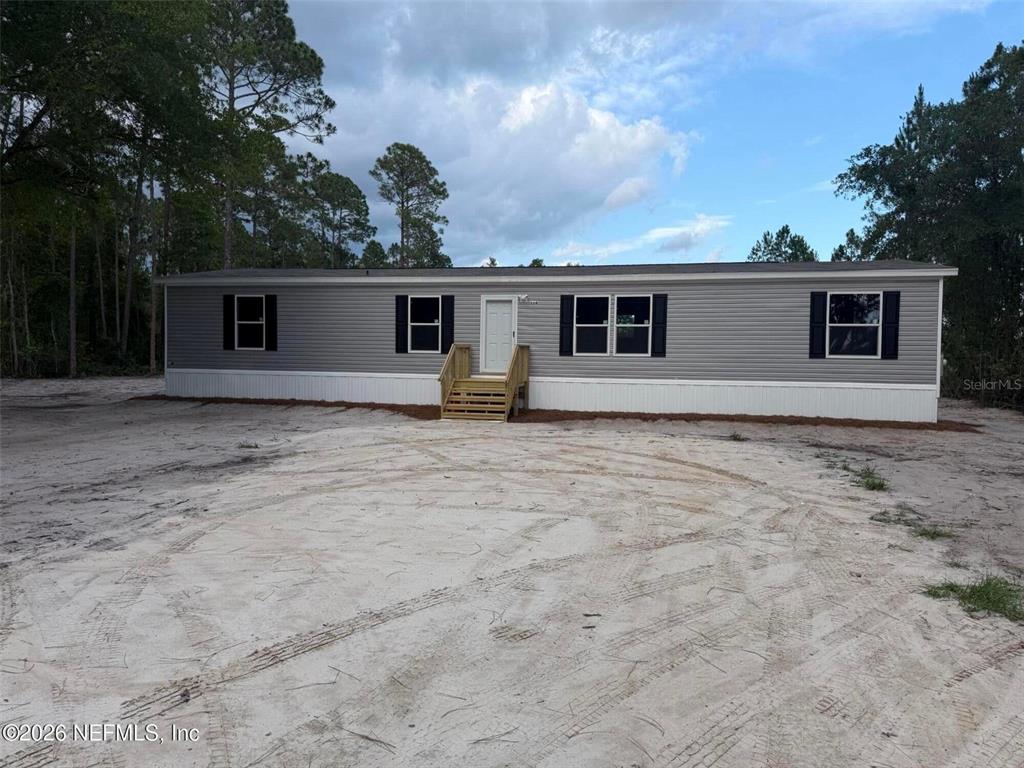 114 Nutmeg Trail Interlachen, FL 32148 - Photo 2 of 33 a house with trees in the background