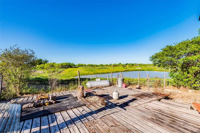 a view of swimming pool with outdoor seating space