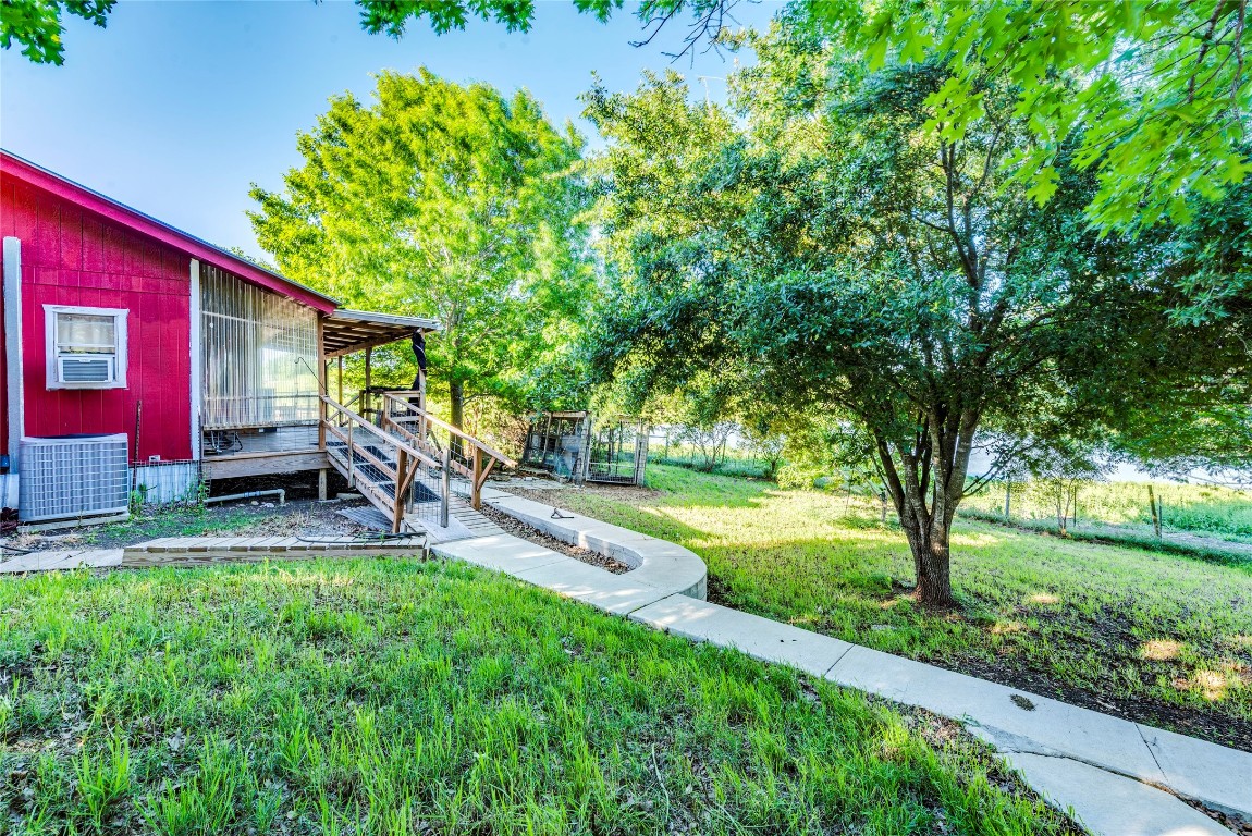 501 Engelke Road Kyle, TX 78640 - Photo 16 of 20 a view of a backyard with a patio