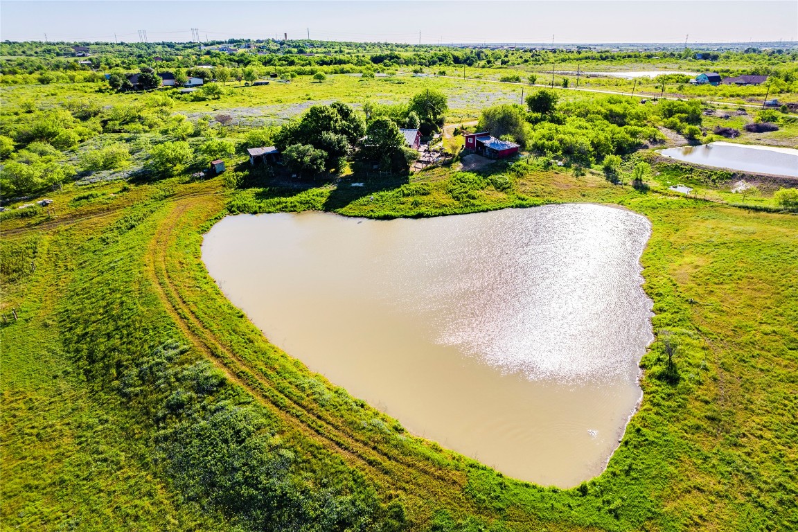 501 Engelke Road Kyle, TX 78640 - Photo 19 of 20 a view of a lake with a houses