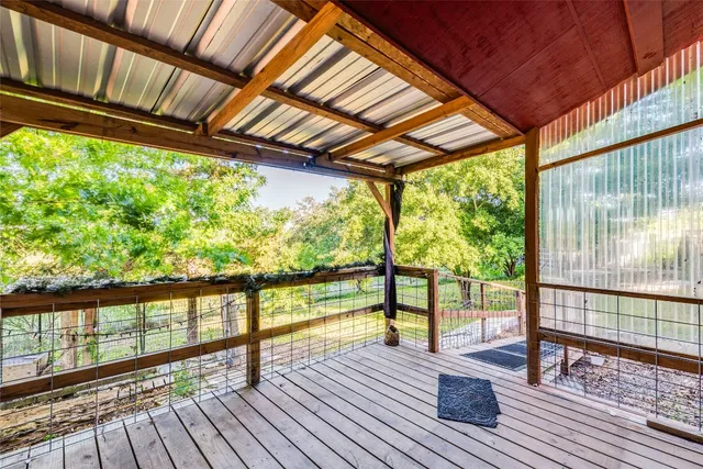 a view of porch with wooden floor