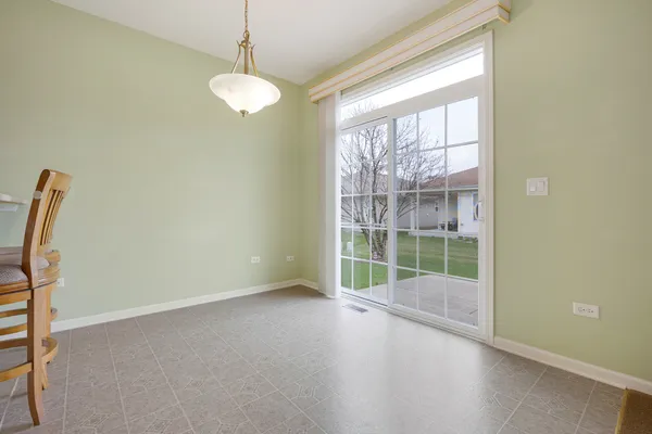a view of a room with window and wooden floor