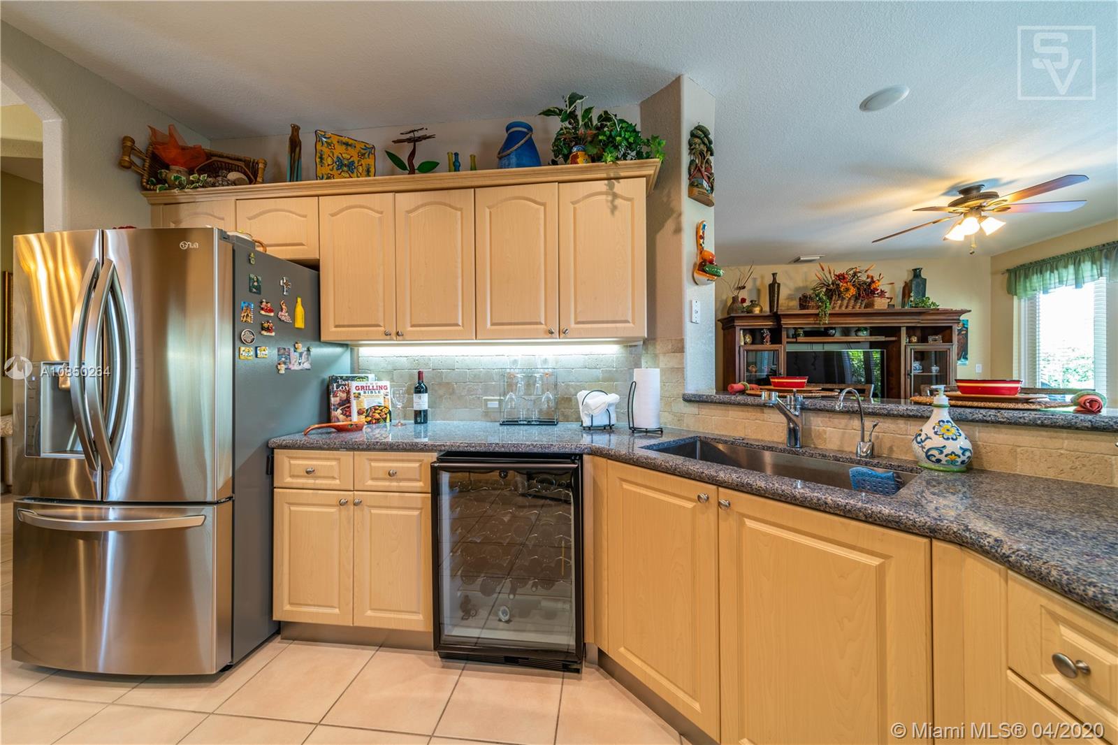 14933 Southwest 22 Street Miami, FL 33185 - Photo 26 of 49 Open Kitchen w/ upgraded backsplash and countertops