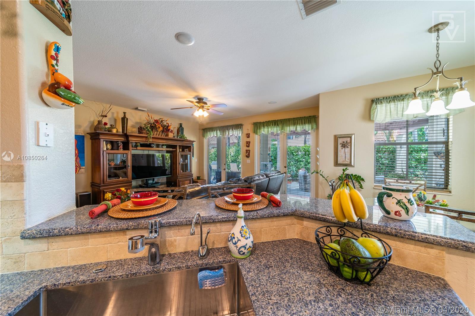 14933 Southwest 22 Street Miami, FL 33185 - Photo 27 of 49 Kitchen overlooks living room & patio