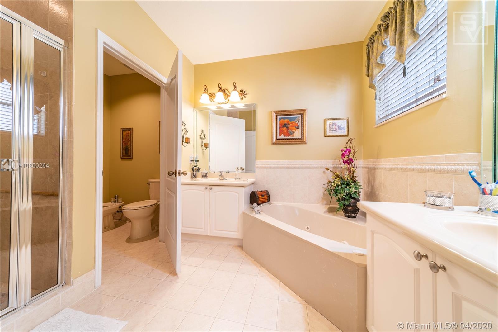 14933 Southwest 22 Street Miami, FL 33185 - Photo 35 of 49 Master Bathroom w/ roman tub & separate shower