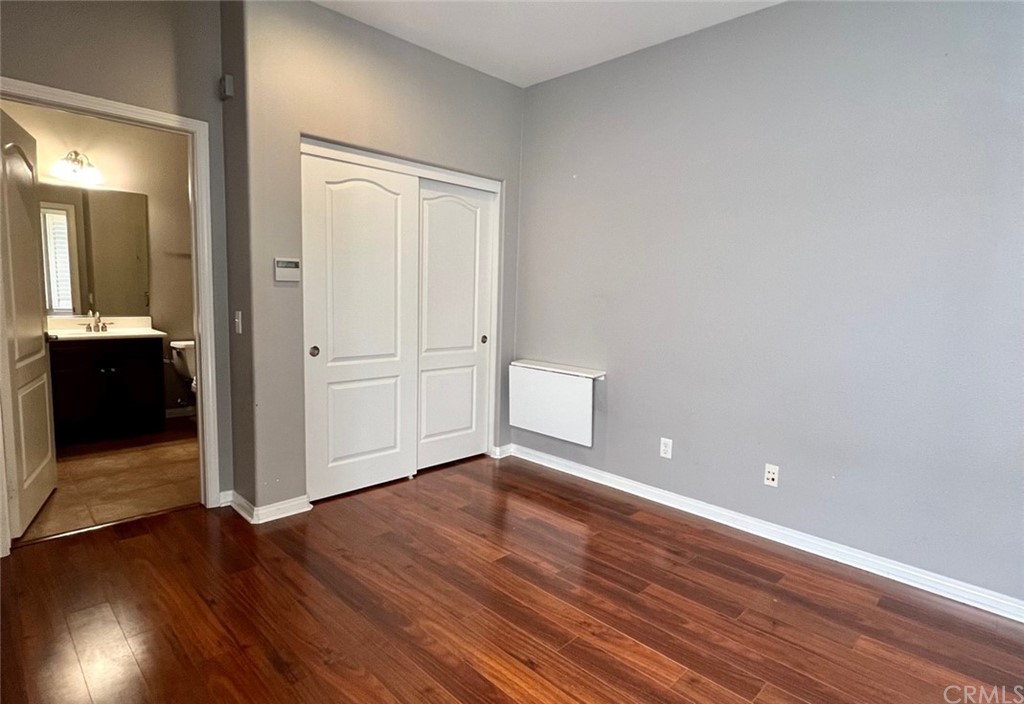 52 Shadowplay Irvine, CA 92620 - Photo 12 of 18 wooden floor in an empty room with a window