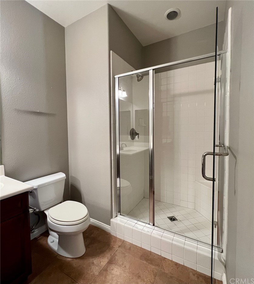 52 Shadowplay Irvine, CA 92620 - Photo 13 of 18 a white toilet next to a bathroom