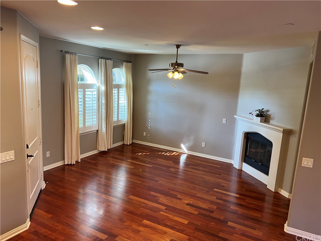 52 Shadowplay Irvine, CA 92620 - Photo 3 of 18 wooden floor in an empty room with a fireplace