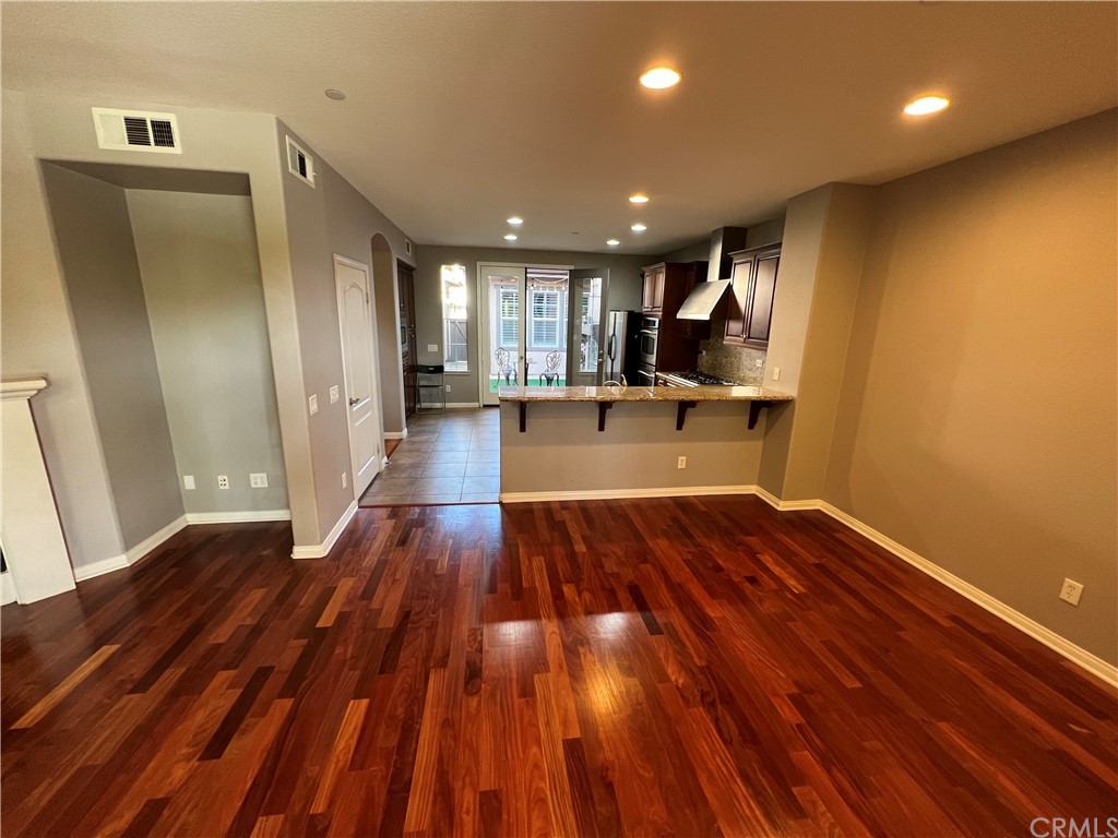 52 Shadowplay Irvine, CA 92620 - Photo 4 of 18 a view of empty room with wooden floor and window