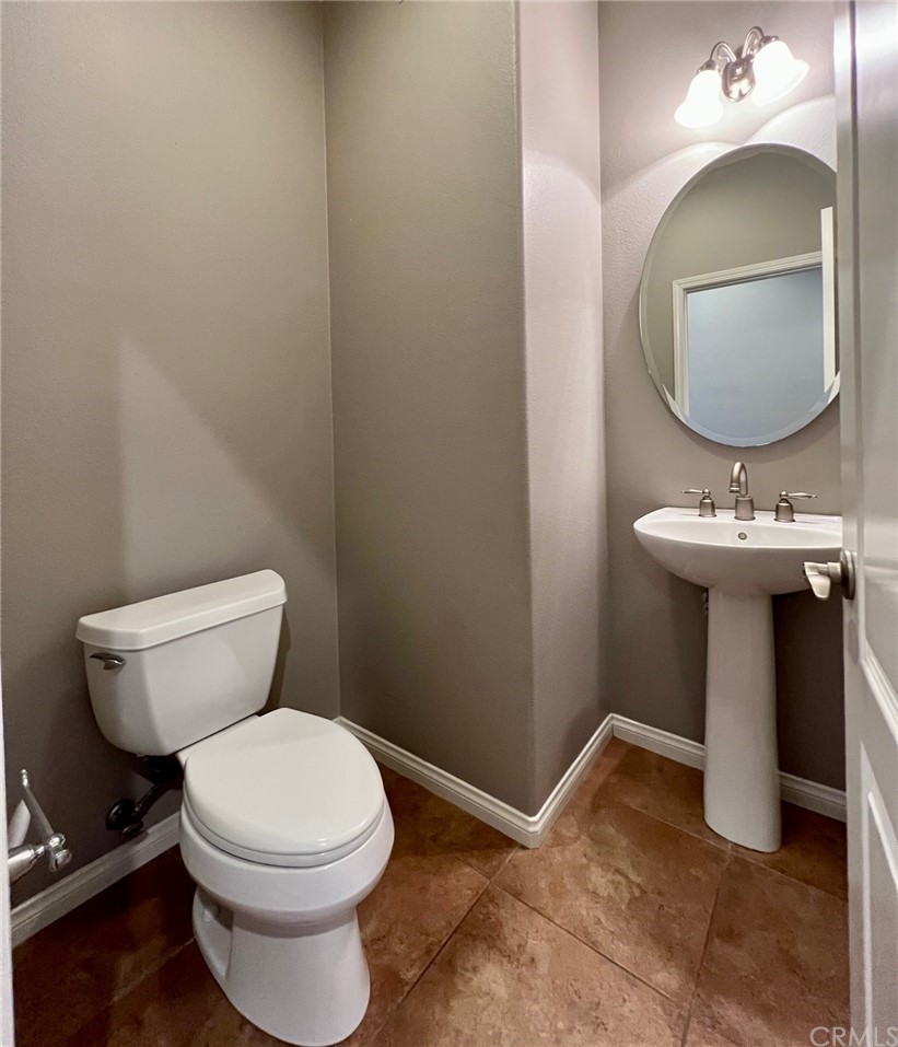 52 Shadowplay Irvine, CA 92620 - Photo 6 of 18 a bathroom with a toilet sink and mirror