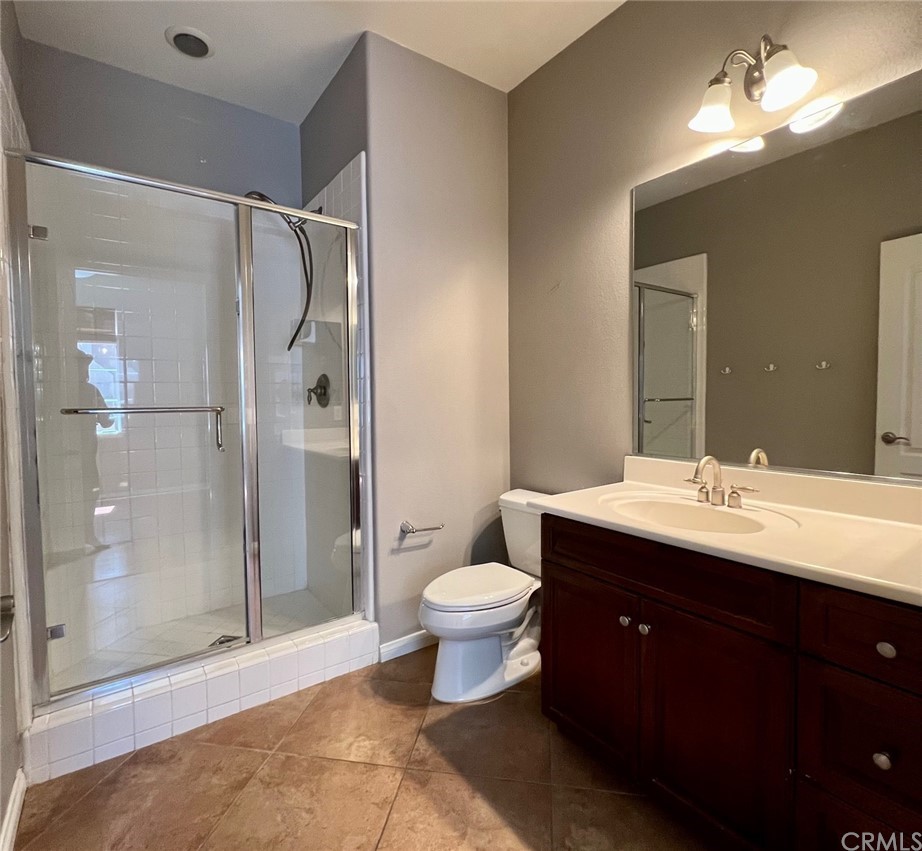 52 Shadowplay Irvine, CA 92620 - Photo 10 of 18 a bathroom with a sink toilet and shower