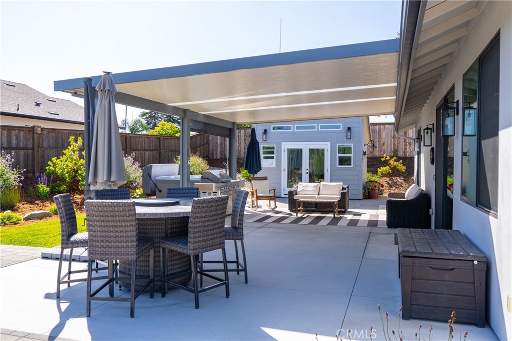8550 El Corte Road Atascadero, CA 93422 - Photo 51 of 72 a view of a patio with dining table and chairs with plants