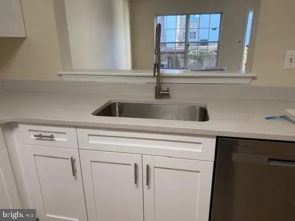 a stove top oven sitting inside of a kitchen