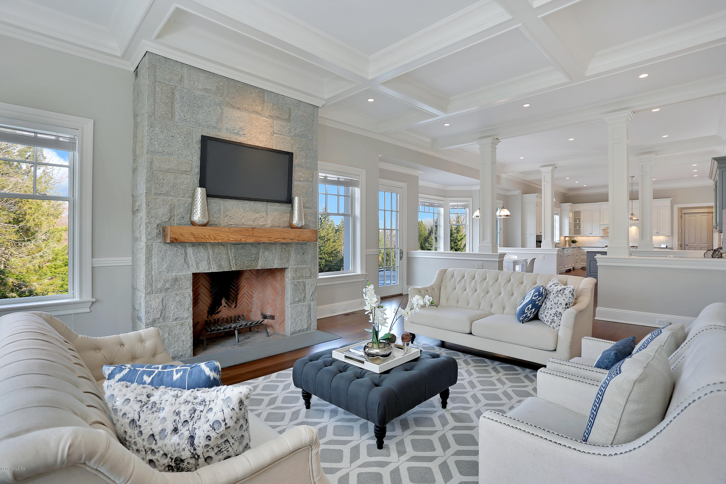 123 Doubling Road Greenwich, CT 06830 - Photo 14 of 31 a living room with furniture a flat screen tv and a fireplace