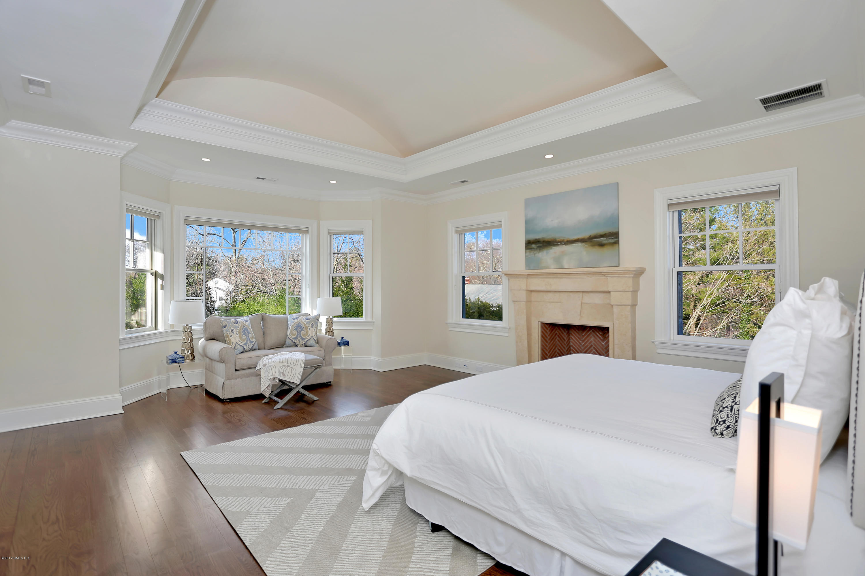 123 Doubling Road Greenwich, CT 06830 - Photo 18 of 31 a spacious bedroom with a balcony furniture and a fireplace