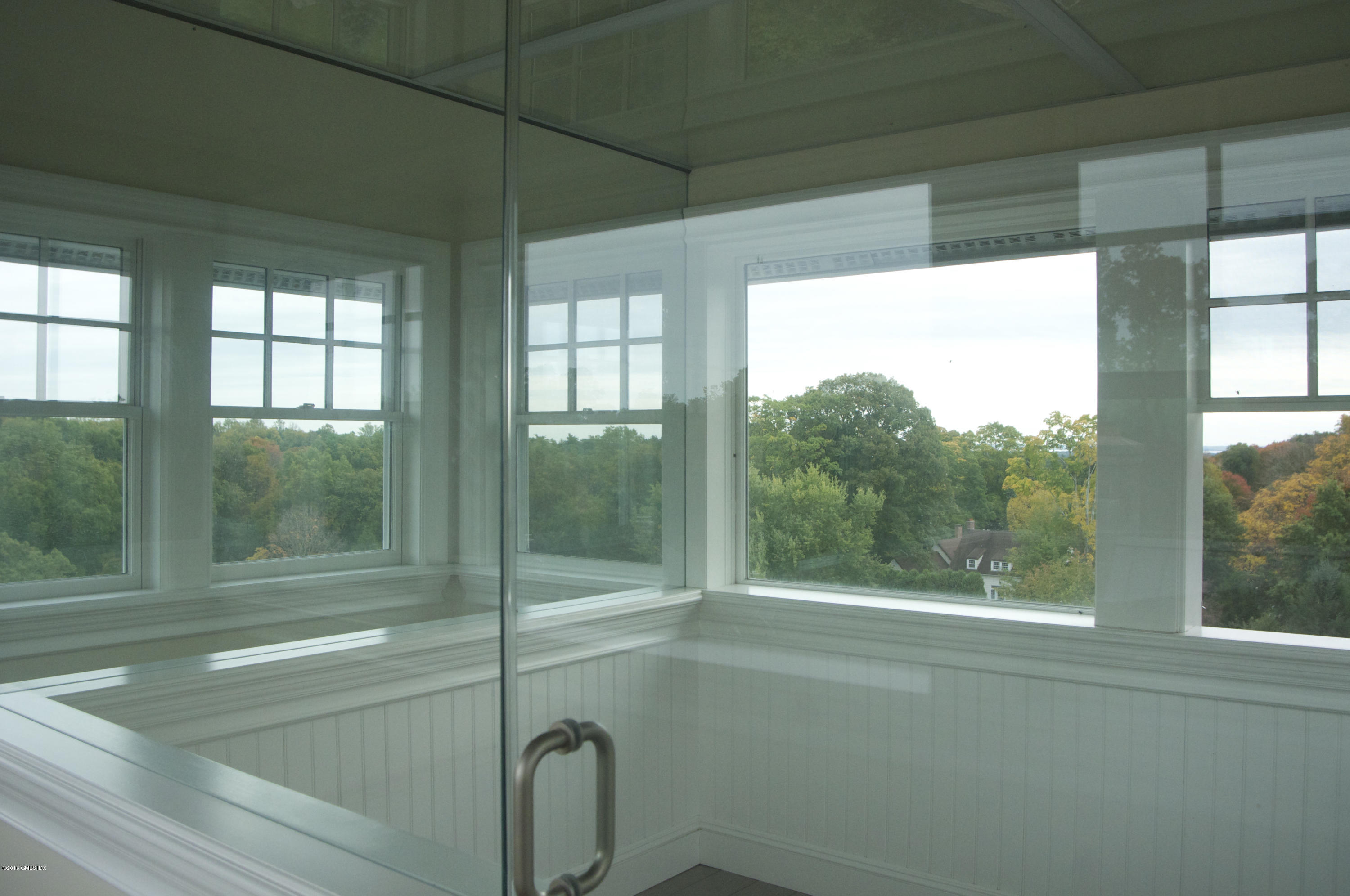 123 Doubling Road Greenwich, CT 06830 - Photo 23 of 31 a bathroom with a glass shower door