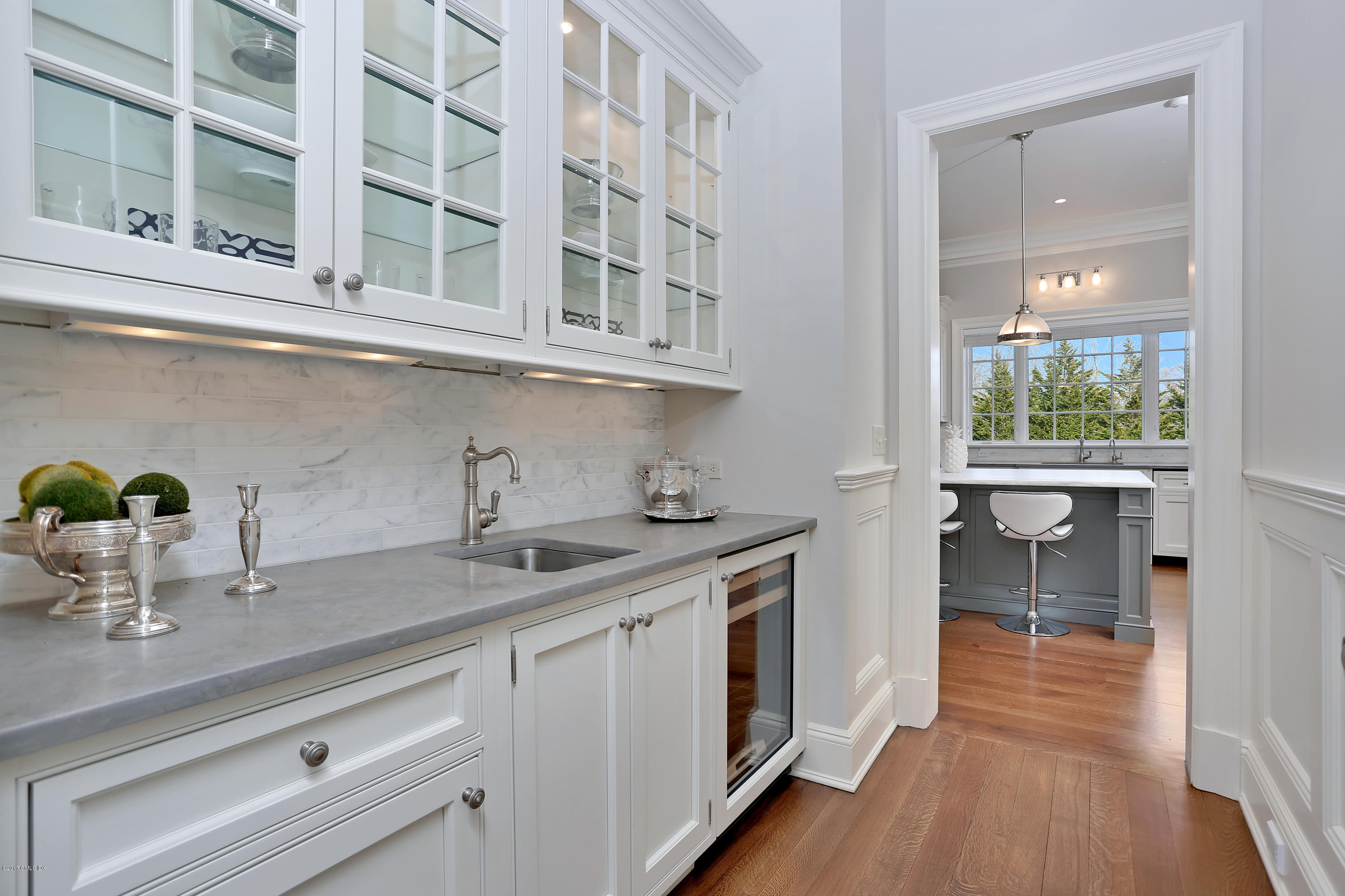 123 Doubling Road Greenwich, CT 06830 - Photo 8 of 31 a kitchen with stainless steel appliances granite countertop a sink and wooden cabinets