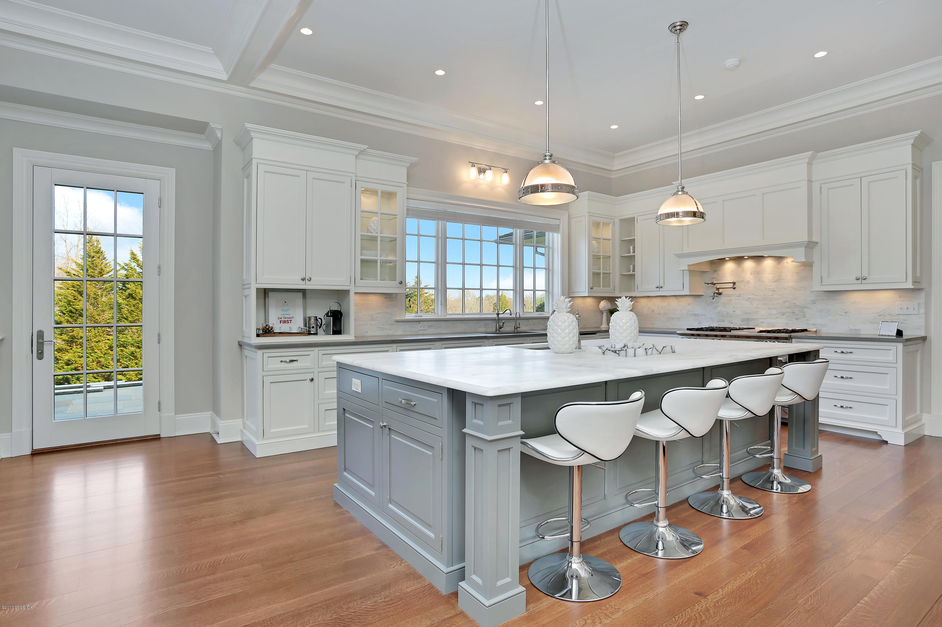 123 Doubling Road Greenwich, CT 06830 - Photo 9 of 31 a large kitchen with kitchen island a sink table and chairs