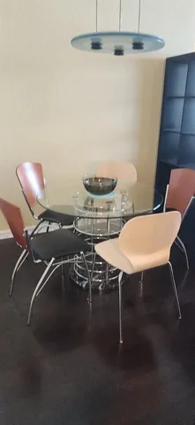 a view of a chairs and table in a room