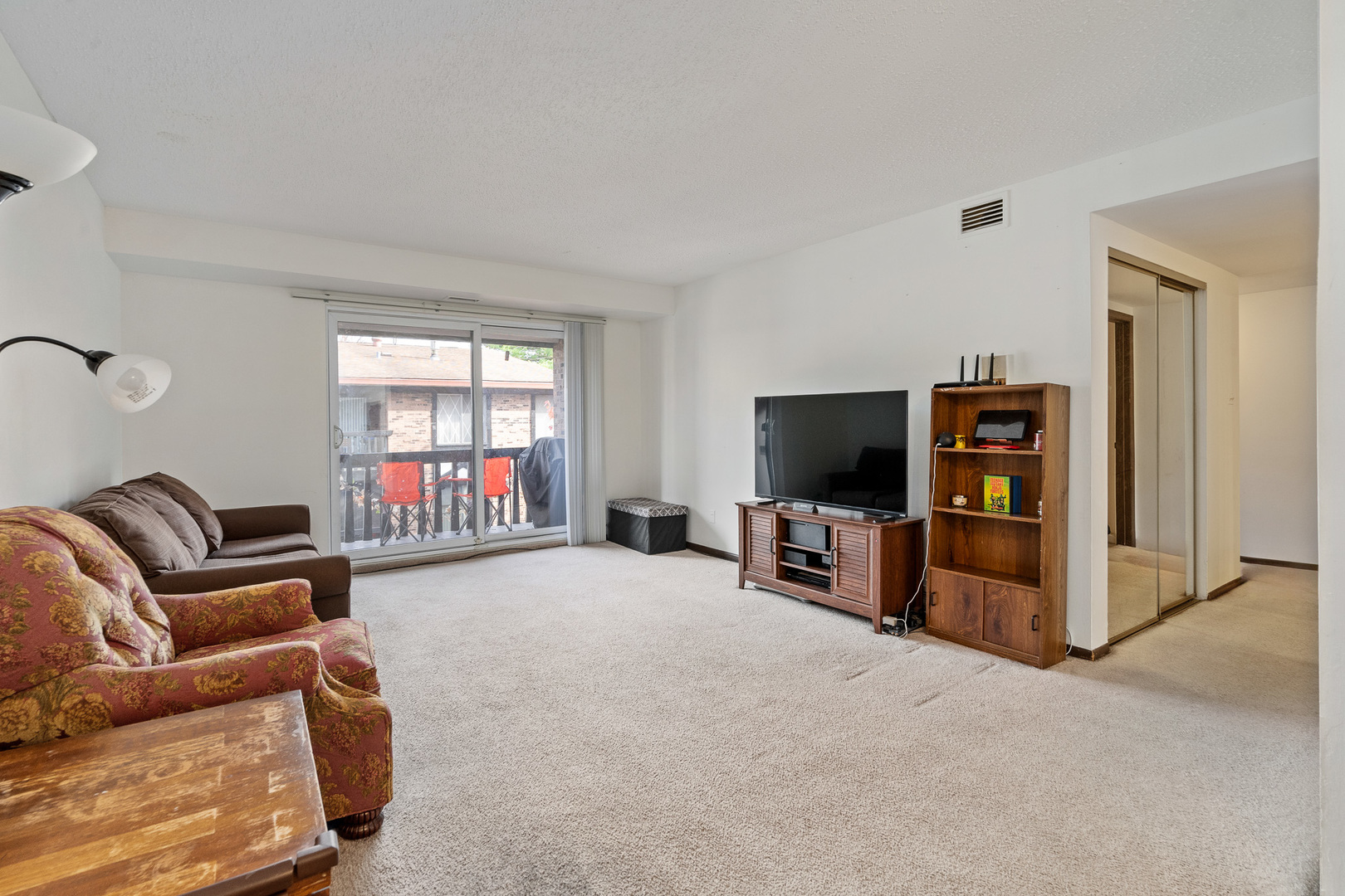 13615 Lavergne Avenue, Unit 110 Crestwood, IL 60418 - Photo 11 of 36 a living room with furniture and a flat screen tv