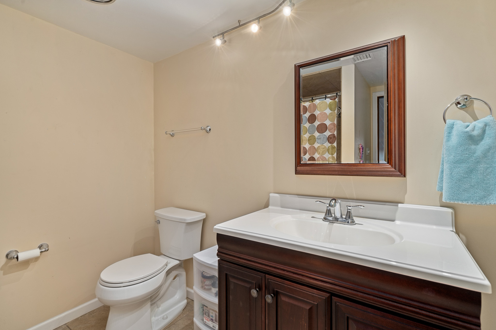 13615 Lavergne Avenue, Unit 110 Crestwood, IL 60418 - Photo 19 of 36 a bathroom with a sink a toilet and a mirror
