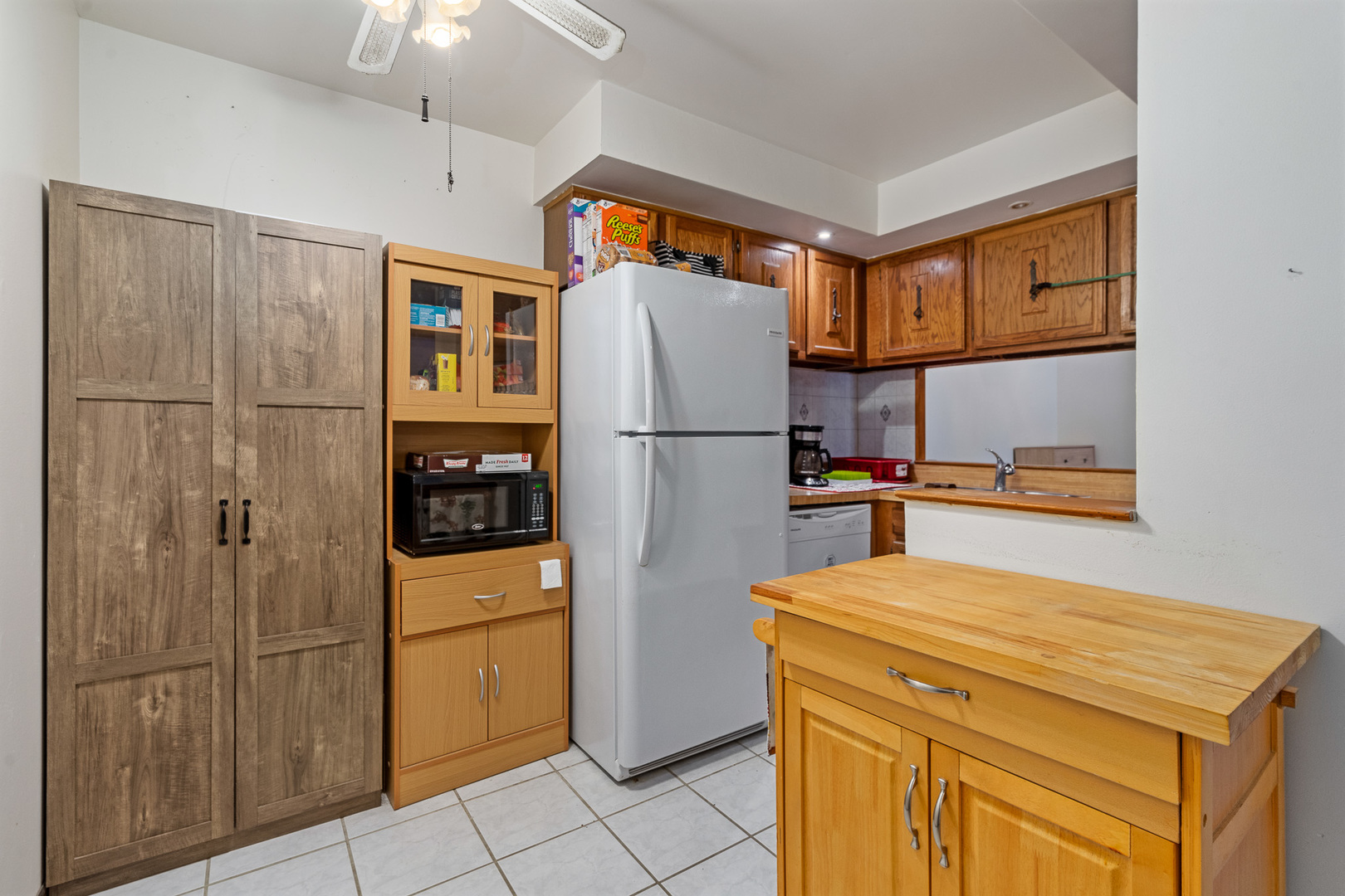 13615 Lavergne Avenue, Unit 110 Crestwood, IL 60418 - Photo 5 of 36 a kitchen with a refrigerator a stove top oven and cabinets