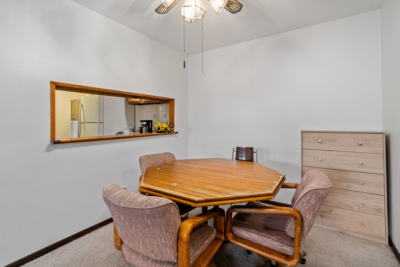 13615 Lavergne Avenue, Unit 110 Crestwood, IL 60418 - Photo 10 of 36 a room with a table and ceiling fan