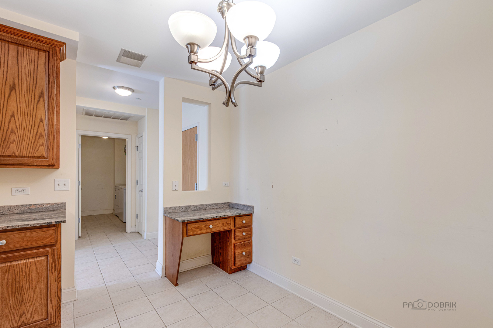 2700 Summit Drive, Unit 209 Glenview, IL 60025 - Photo 11 of 23 a view of a kitchen with granite countertop cabinets
