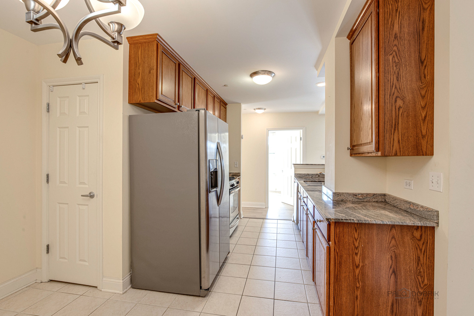 2700 Summit Drive, Unit 209 Glenview, IL 60025 - Photo 12 of 23 a kitchen with stainless steel appliances granite countertop a refrigerator and a stove top oven
