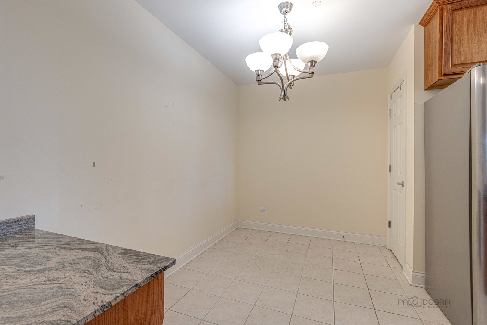 2700 Summit Drive, Unit 209 Glenview, IL 60025 - Photo 13 of 23 a view of a kitchen with a sink and chandelier