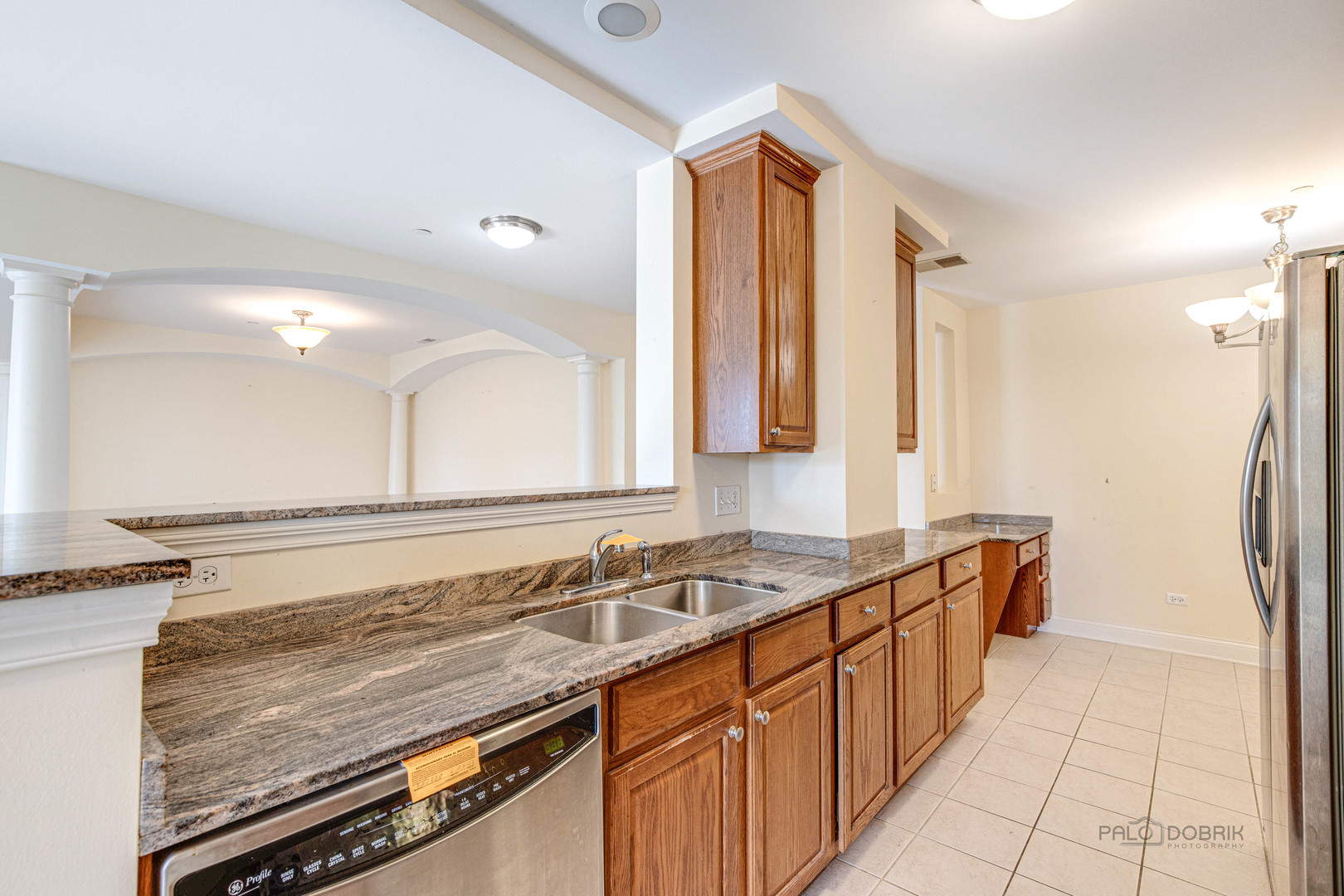 2700 Summit Drive, Unit 209 Glenview, IL 60025 - Photo 9 of 23 a bathroom with a granite countertop sink and a mirror