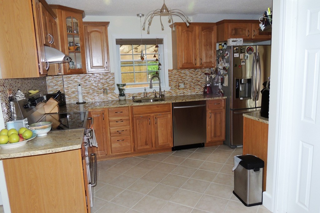 820 Dickinson Street Springfield, MA 01108 - Photo 3 of 29 a kitchen with a sink appliances and cabinets