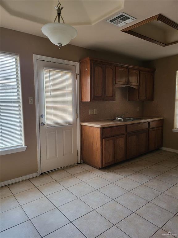 1507 East Coyote Street, Unit C Pharr, TX 78577 - Photo 11 of 16 a kitchen with stainless steel appliances a sink and cabinets