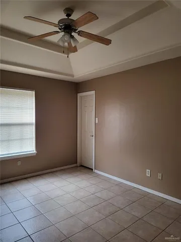 a view of an empty room and a window