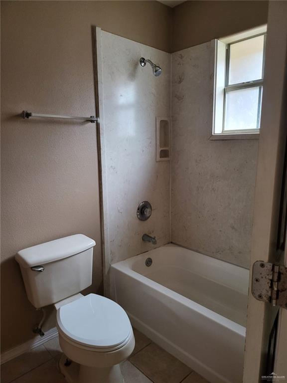 1507 East Coyote Street, Unit C Pharr, TX 78577 - Photo 9 of 16 a white toilet sitting next to a bath tub