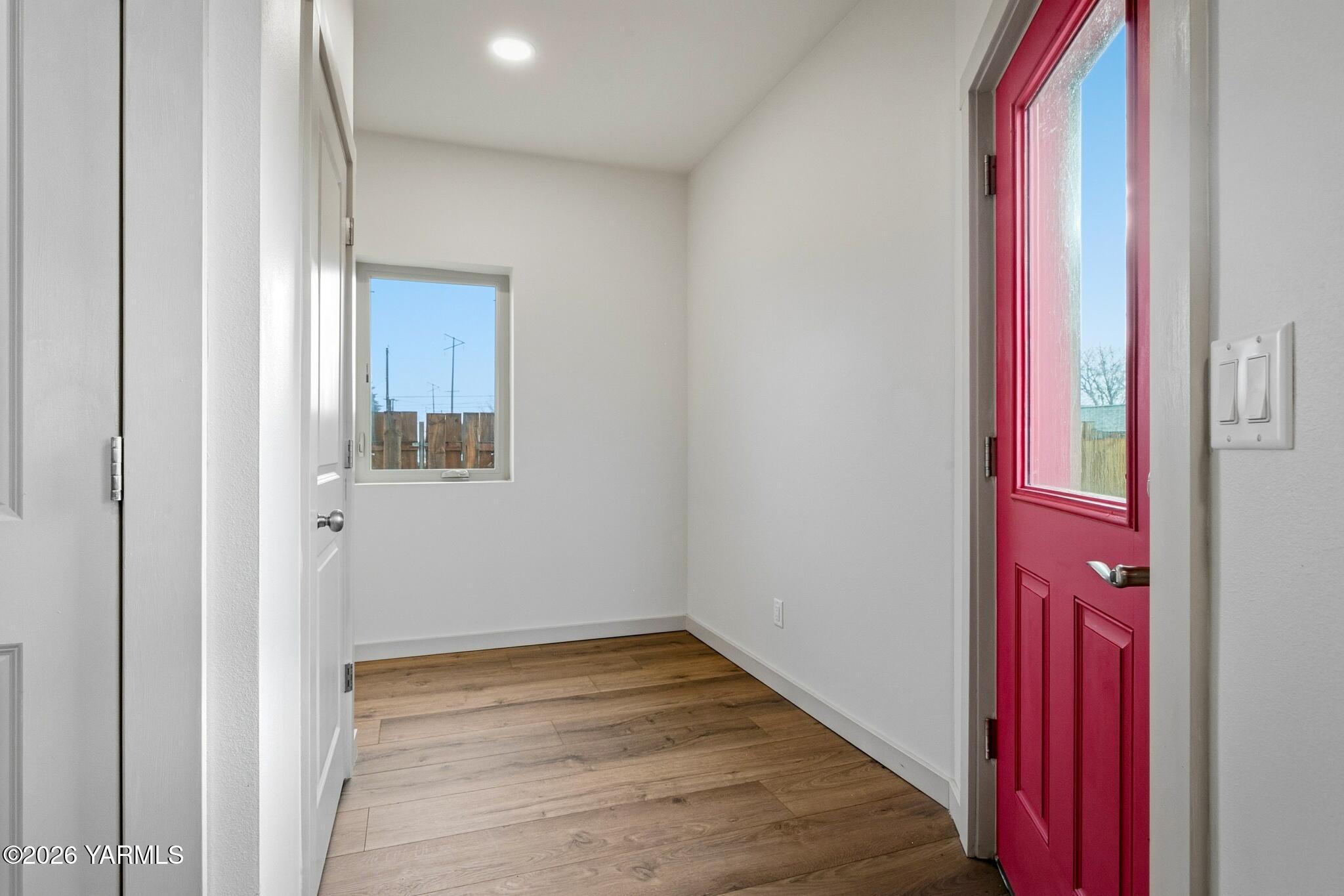 801 South 16th Avenue, Unit 4 Yakima, WA 98902 - Photo 13 of 22 a view of a room with wooden floor and a bathroom
