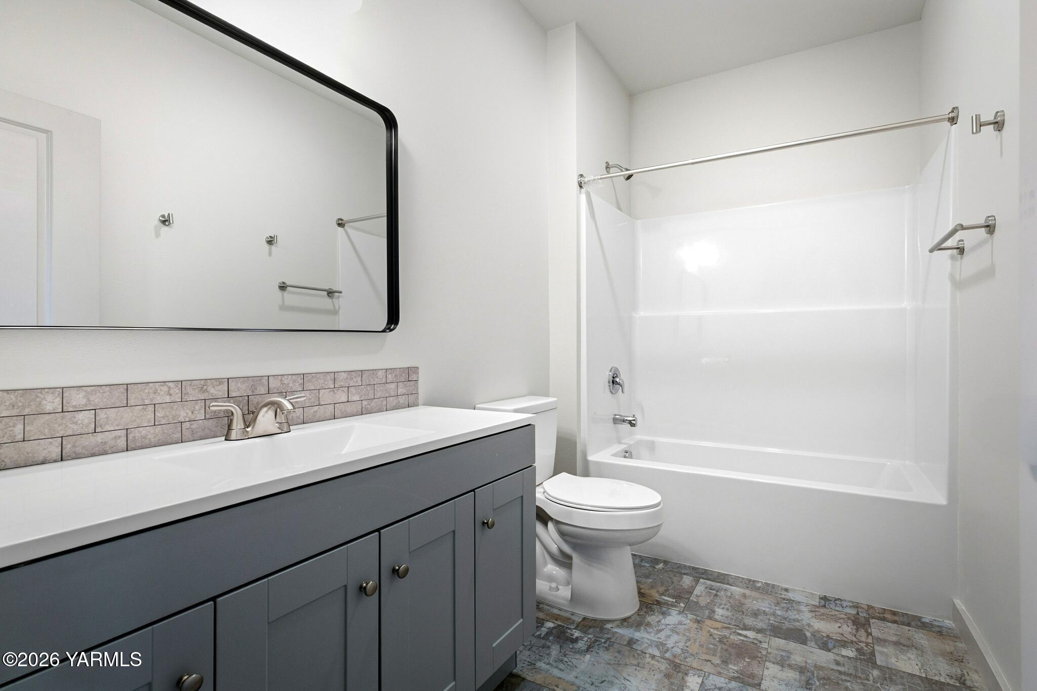 801 South 16th Avenue, Unit 4 Yakima, WA 98902 - Photo 19 of 22 a bathroom with a sink toilet and shower