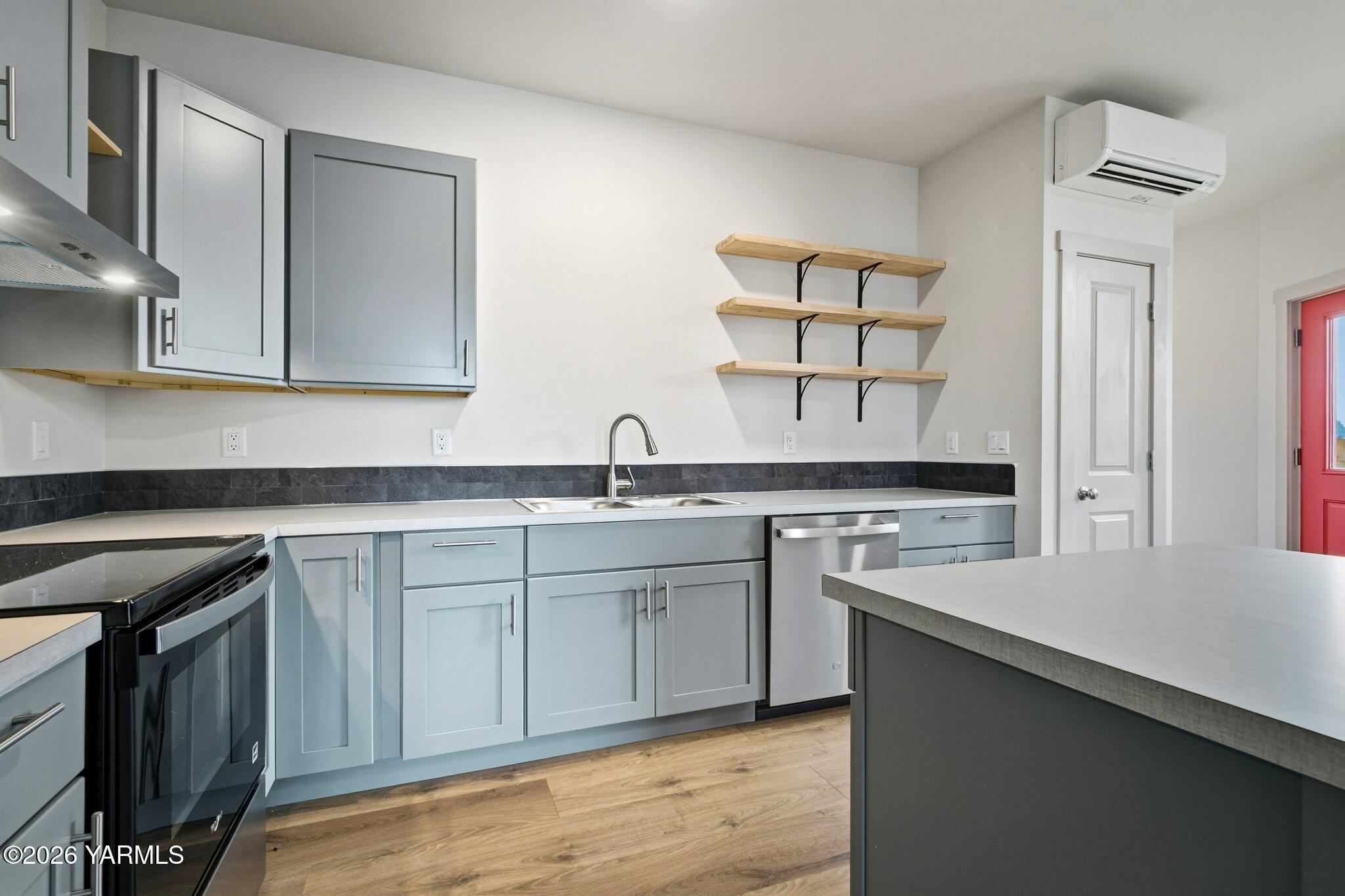 801 South 16th Avenue, Unit 4 Yakima, WA 98902 - Photo 9 of 22 a kitchen with a sink stove and cabinets