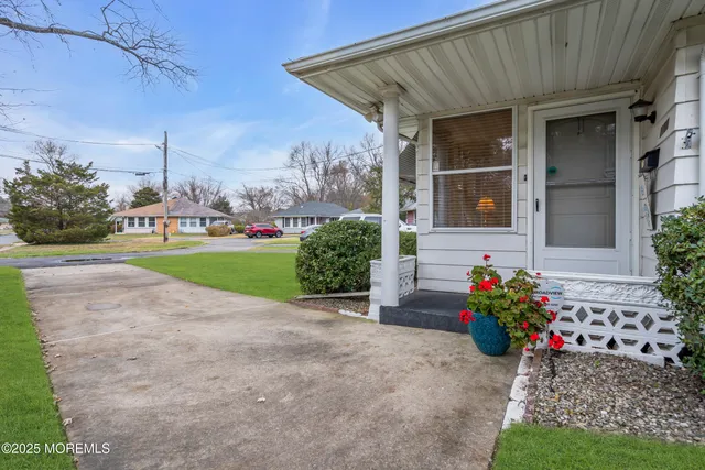 a view of a house with a yard and plants