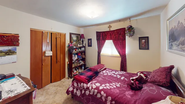 a bed room with a bed and a window